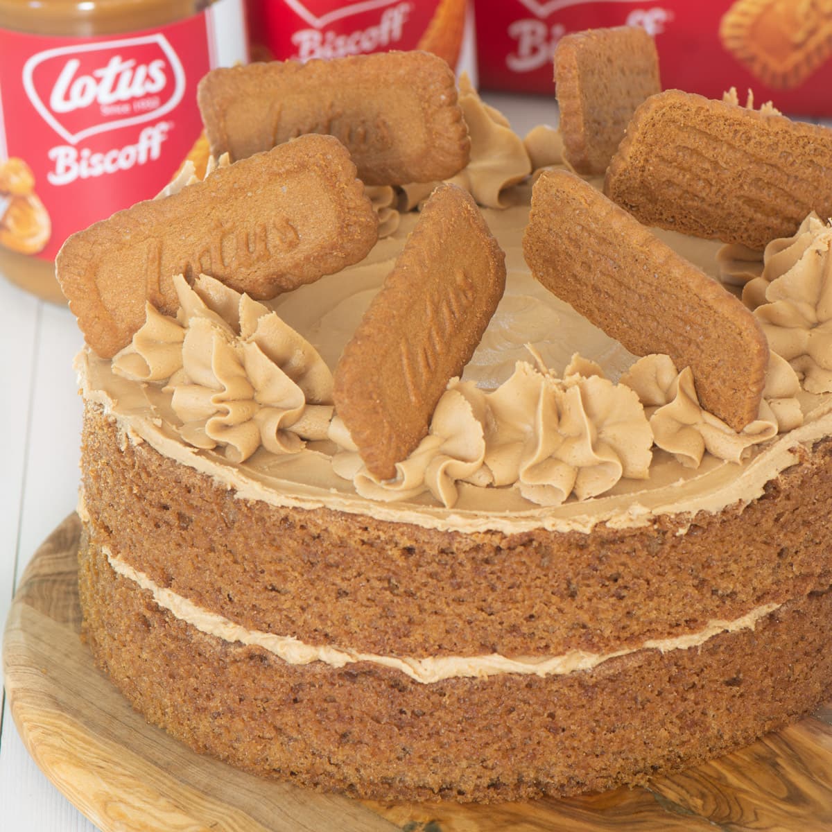 Biscoff cake on a wooden board.