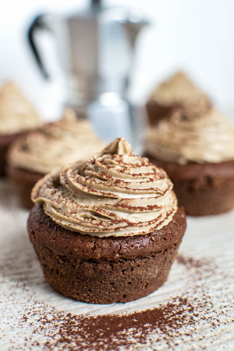 A cocoa cupcake topped with coffee frosting.