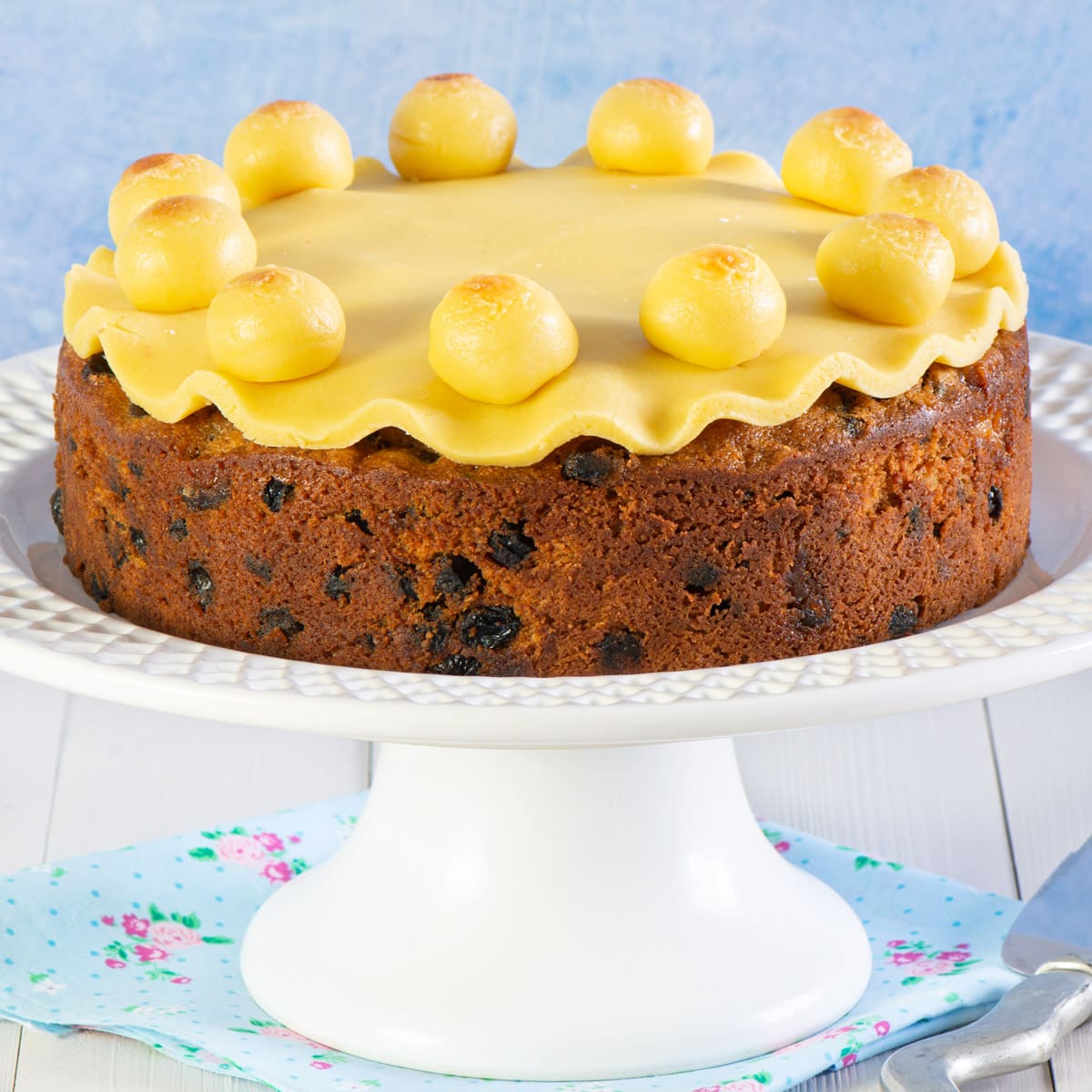Decorated simnel cake on a cake stand. 