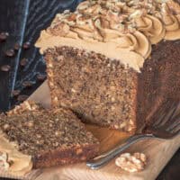 Coffee and walnut loaf cake which has been sliced.