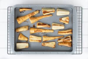 Roasted parsnips in a baking tray