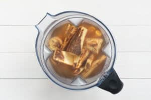 Roasted parsnips, spices and stock in a blender.